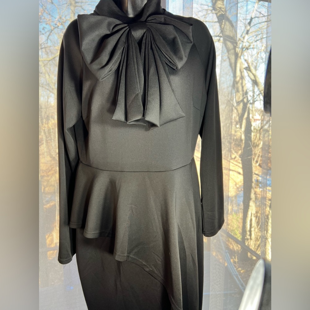 Beautiful Brand New black dress with amazing design. Very comfortable XL